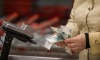 Russians cut their cash payments by half